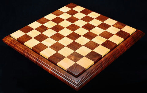 a wooden chess board on black background